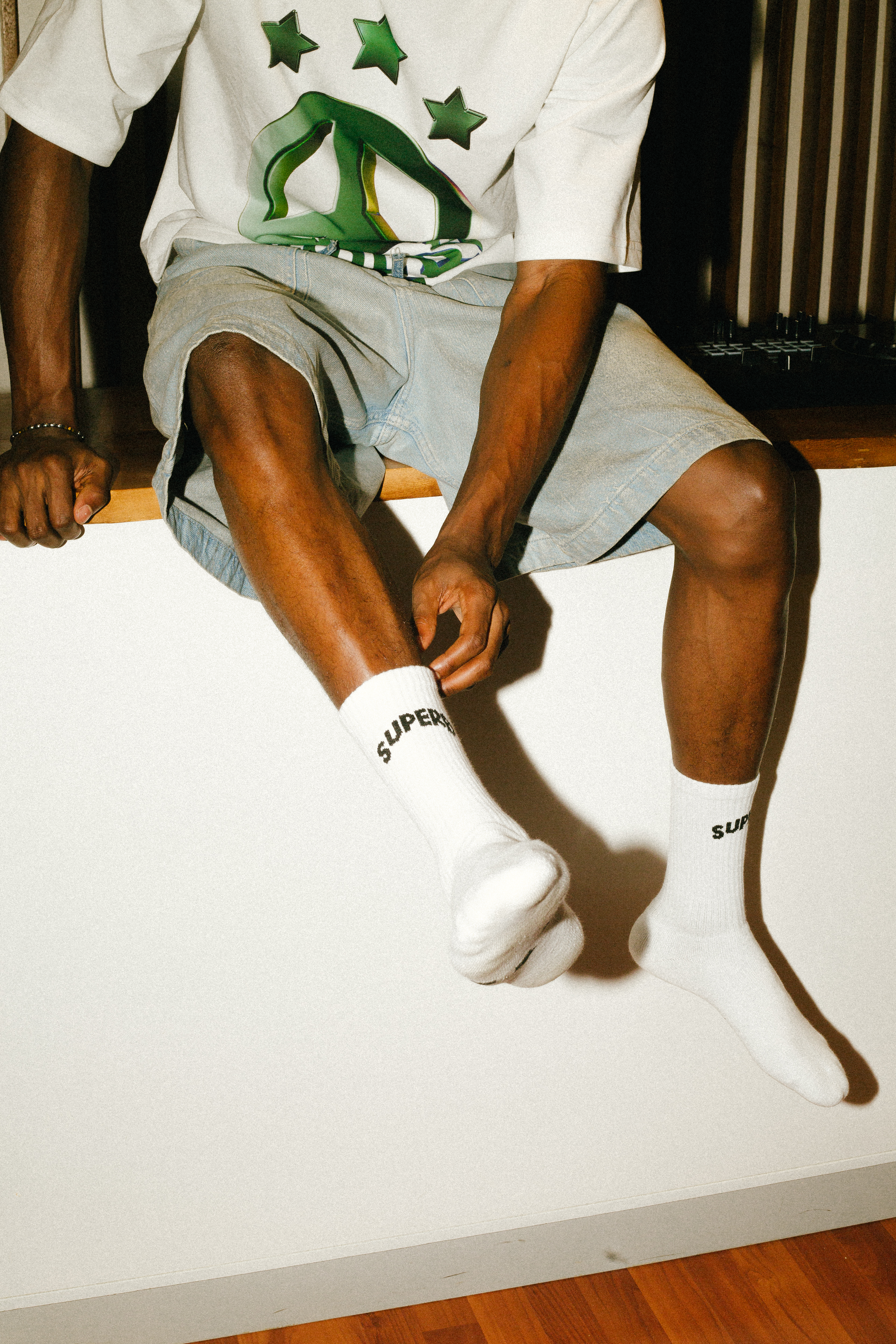 Model in white oversized SUPERB peace tee